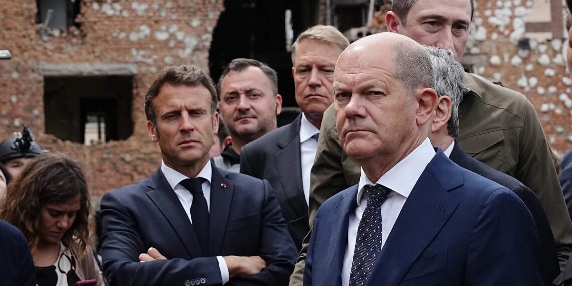 إيمانويل ماركون، وأولاف شولتز.صورة.جلوبال برس